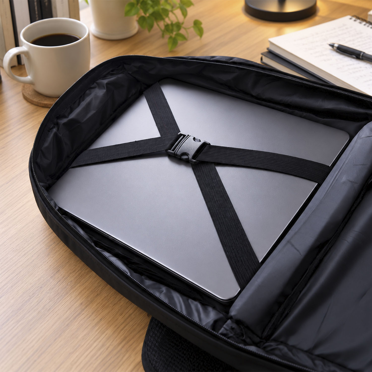 Soft Padded Laptop Backpack Solid black fabric with a matte finish, Water-resistant synthetic material (nylon/polyester)